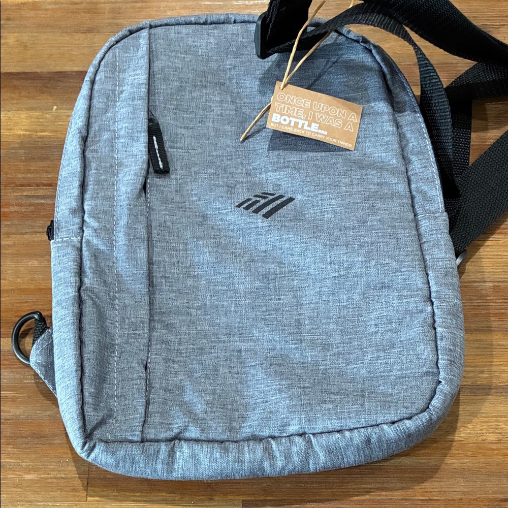 Eco-Friendly Gray crossover Bag, also a cooler to keep lunch and water cold.
